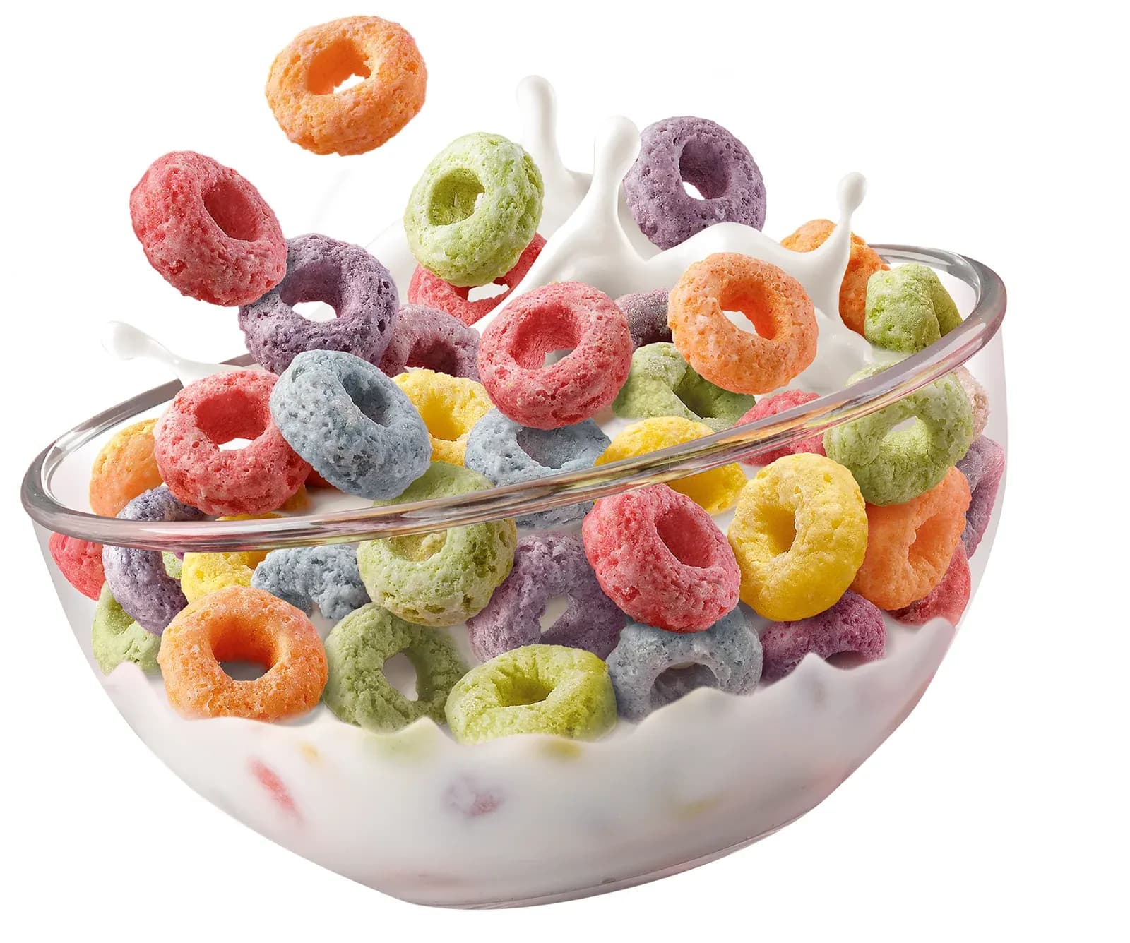 A glass bowl of multicoloured Froot Loops cereal rings with milk splashing over them