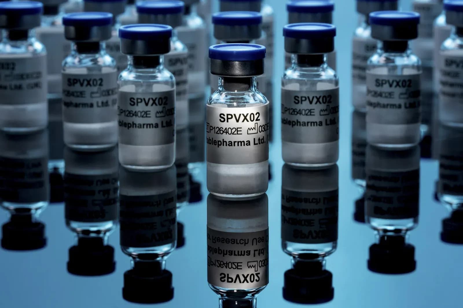Glass vials of the SPVX02 tetanus and diphtheria vaccine, one in focus in front of rows of others