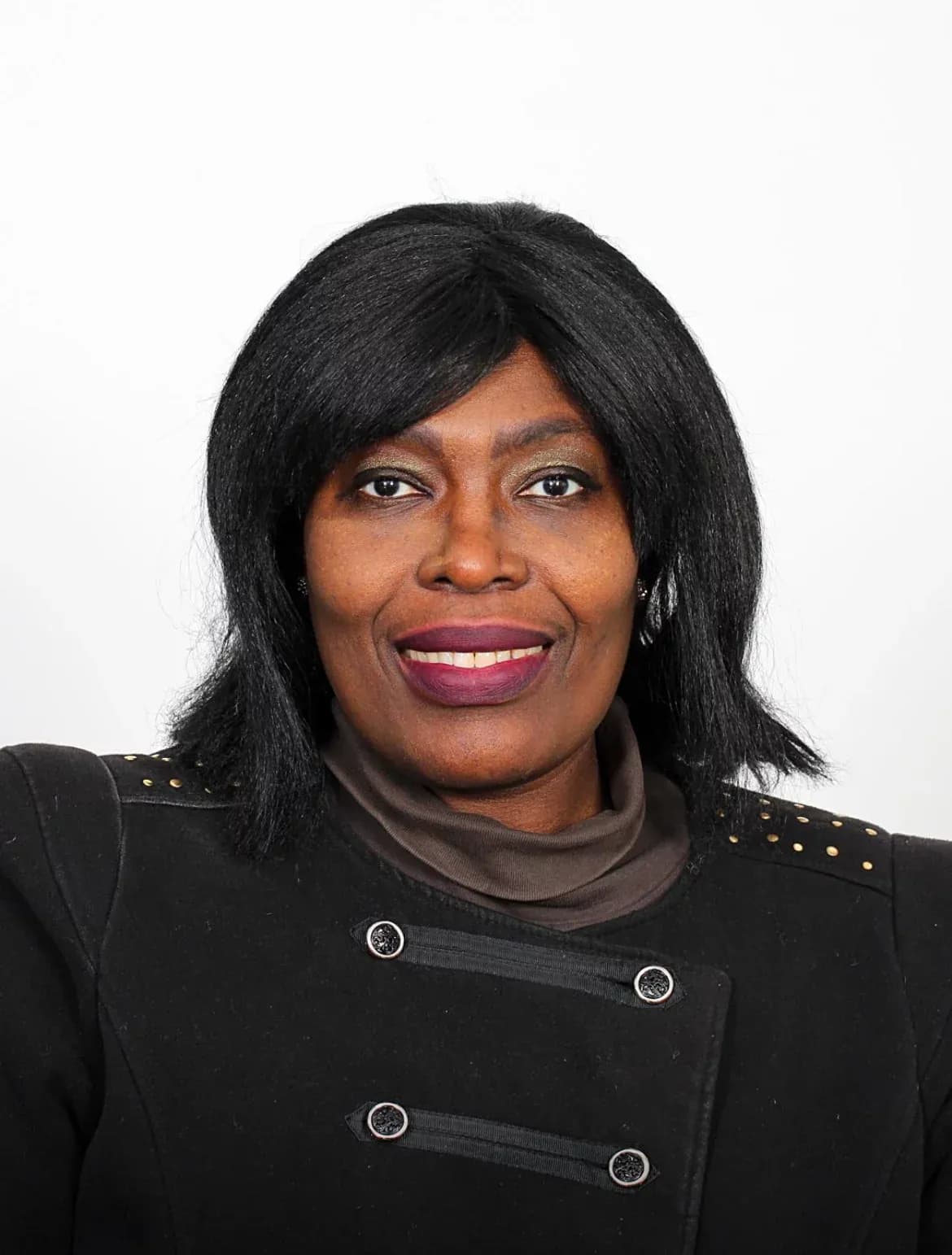Dr I. Fortune Glavee in a black jacket against a white background